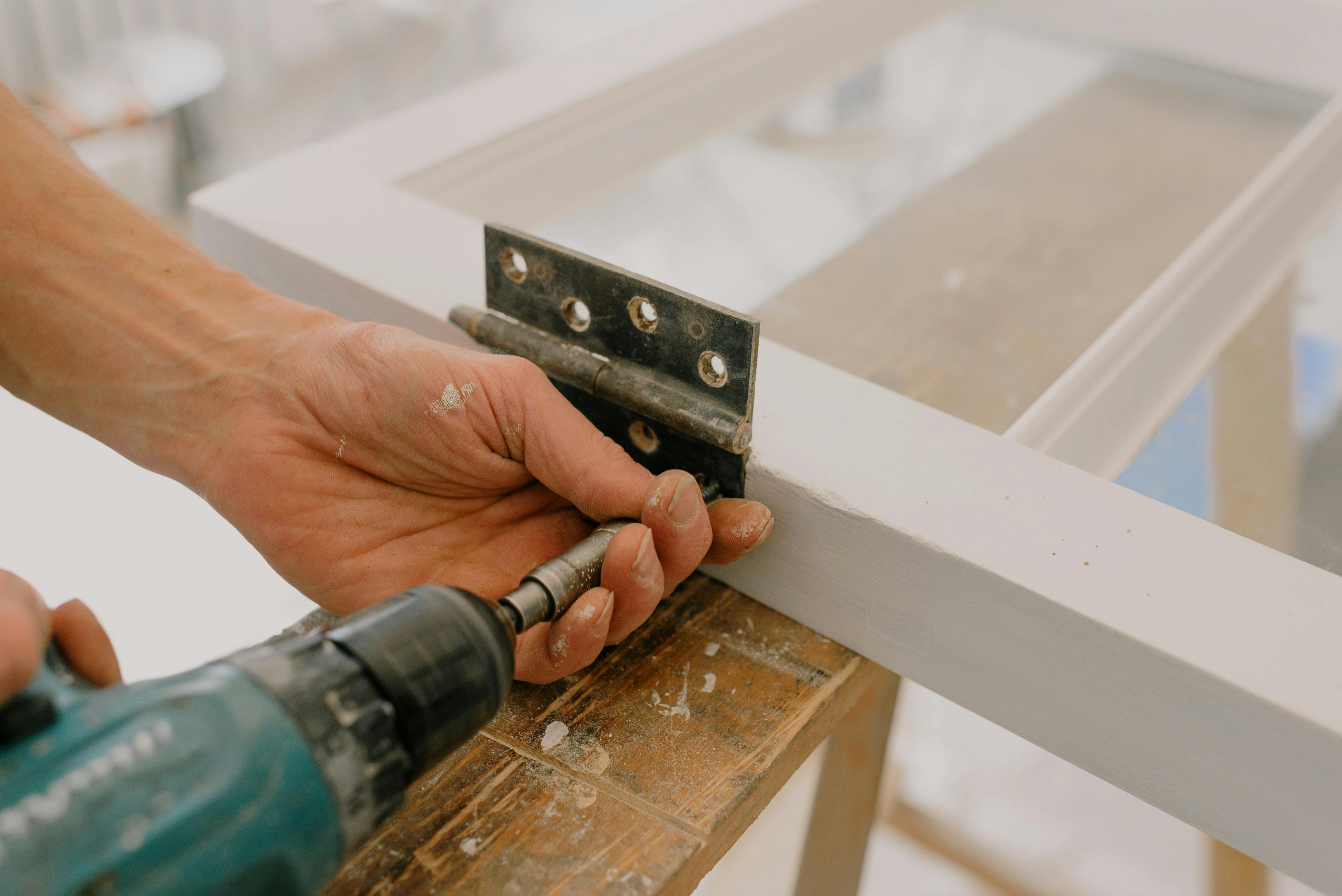 Attaching a hinge with a drill